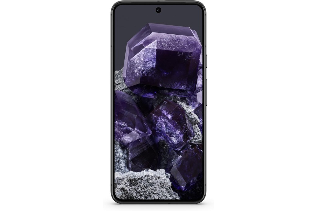 A black rectangular cell phone displaying a purple crystal on the screen