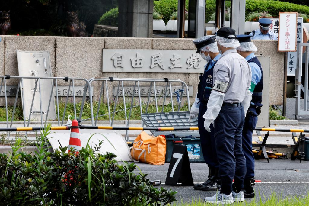 The man, who was arrested on the spot, had driven his car into nearby fencing, the news reports said. His motive for the attack was not immediately clear.