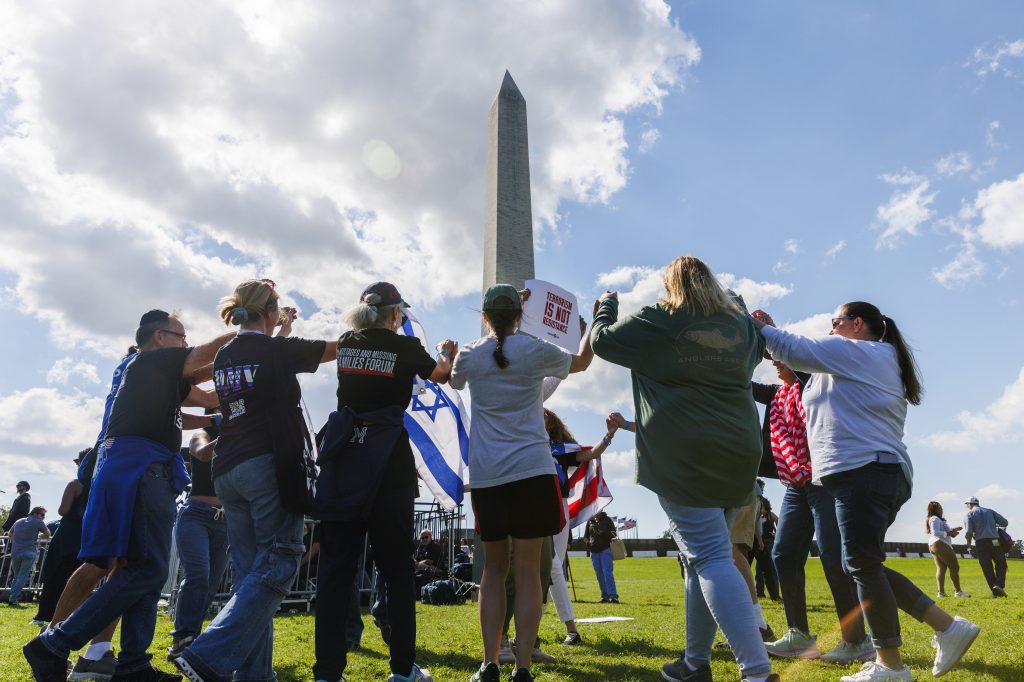 Supporters attend an event by the Washington Monument on the Washington Mall, in DC.