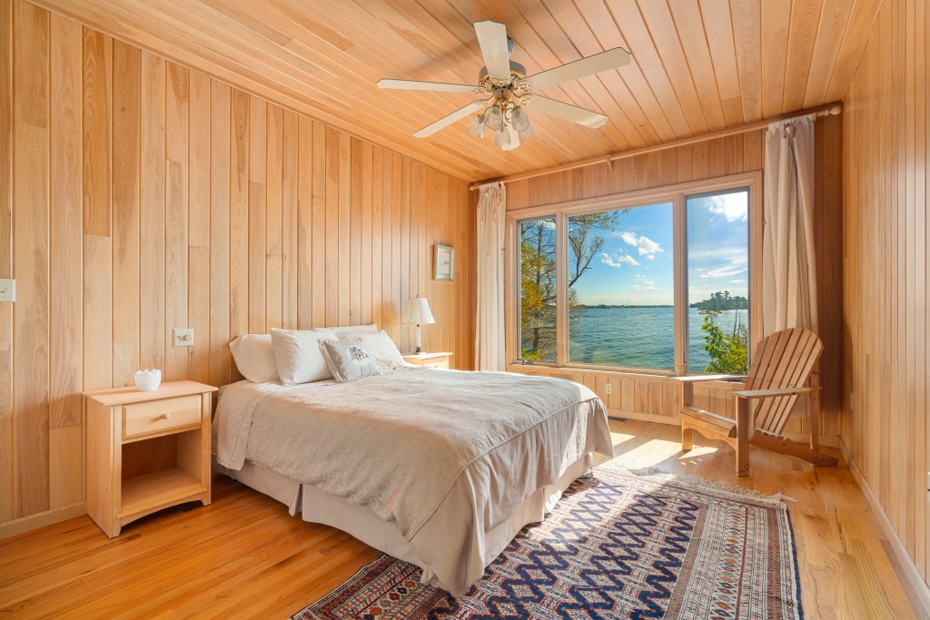 This secondary bedrooms looks out to serene water views.