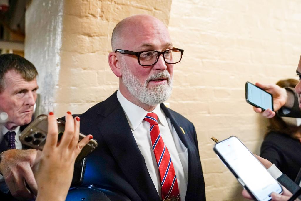 Rep. Derrick Van Orden, D-Wis., in suit and tie, speaking with reporters at the Republican caucus meeting at the Capitol in Washington, Oct. 19, 2023