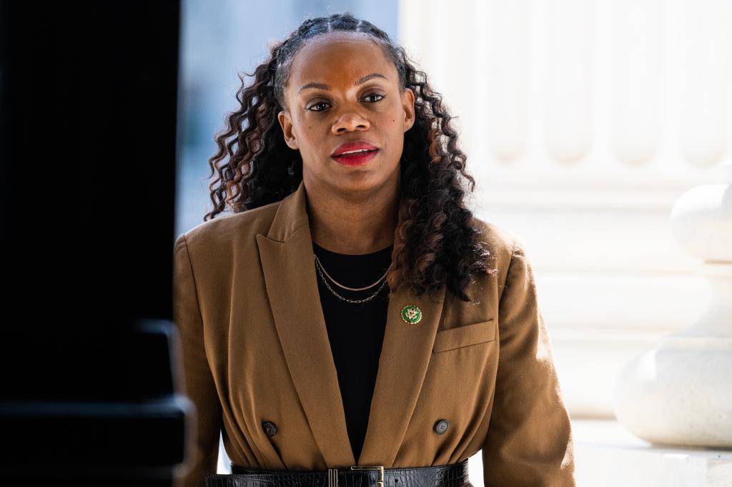 Rep. Summer Lee, D-Pa., in a brown jacket, arriving at the U.S. Capitol for the last votes of the week on May 18, 2023.