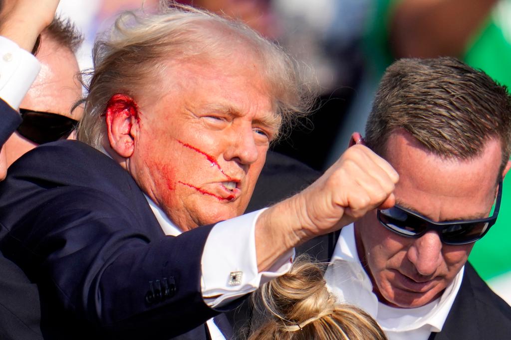 Republican presidential candidate former President Donald Trump reacts following an assassination attempt at a campaign event in Butler, Pa., on Saturday, July 13, 2024.