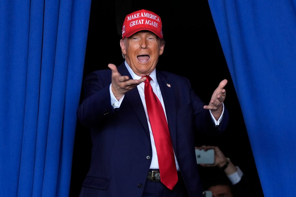 Republican presidential nominee former President Donald Trump arrives to speak during a campaign rally at Dodge County Airport, Sunday, Oct. 6, 2024, in Juneau, Wis.