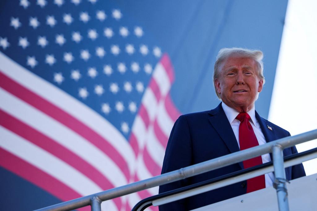 Republican presidential nominee and former U.S. President Donald Trump looks on as he disembarks "Trump Force One" at Detroit Metropolitan Wayne County Airport, in Detroit, Michigan, U.S. October 18, 2024.