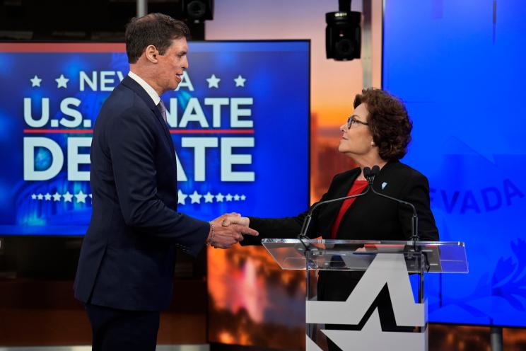 Republican Senate candidate Sam Brown and Sen. Jacky Rosen shaking hands before the Nevada Senate Debate in Las Vegas, 2024