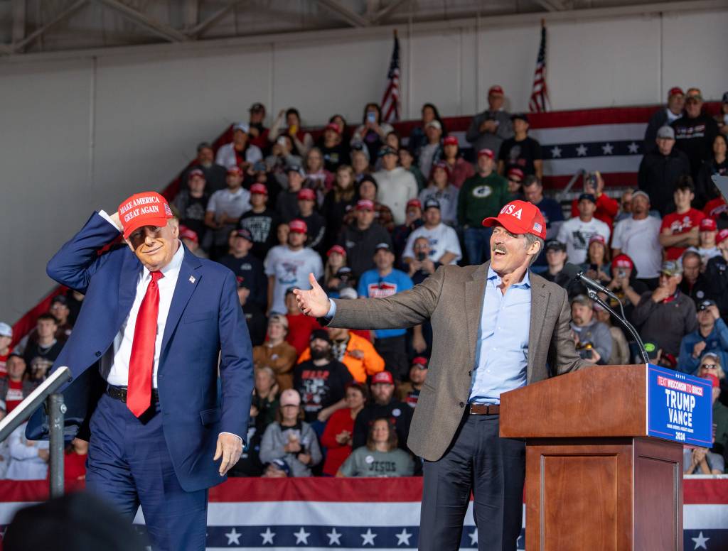 Republican U.S Senate candidate Eric Hovde and former President Donald J. Trump on stage at a rally at the Dodge County Airport, Juneau, Wis., on October 6, 2024