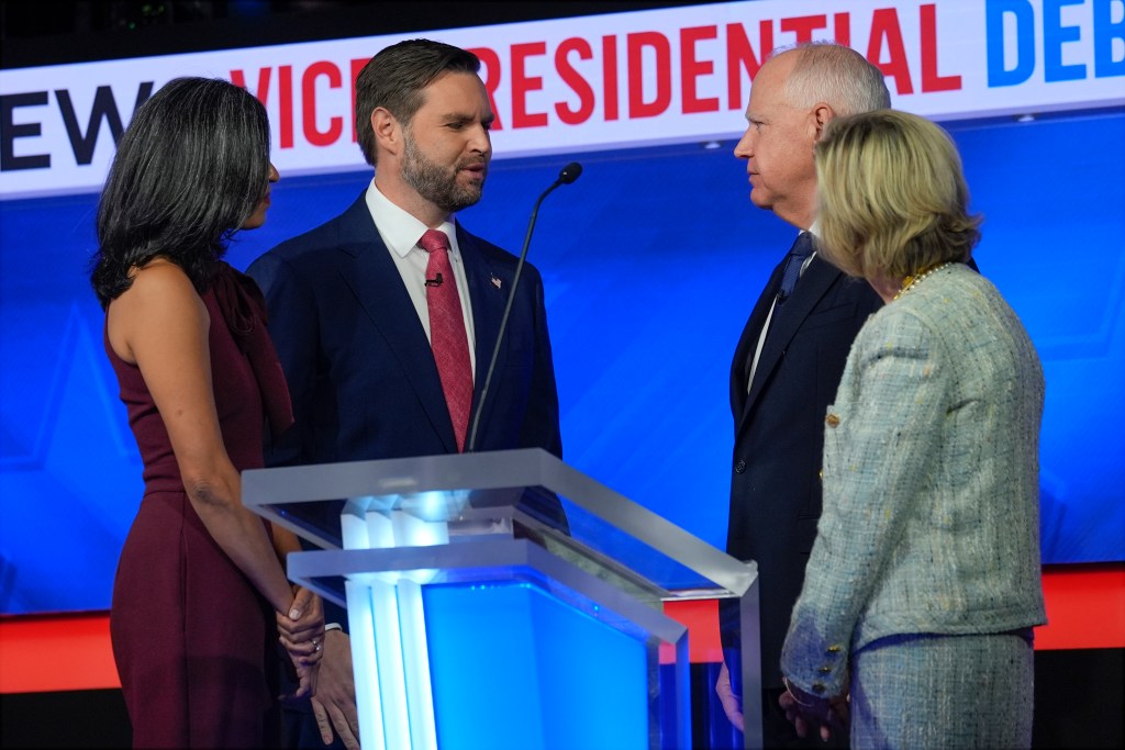 JD Vance and his wife speak with Tim Walz and his wife after the vice presidential debate on Oct. 1, 2024.