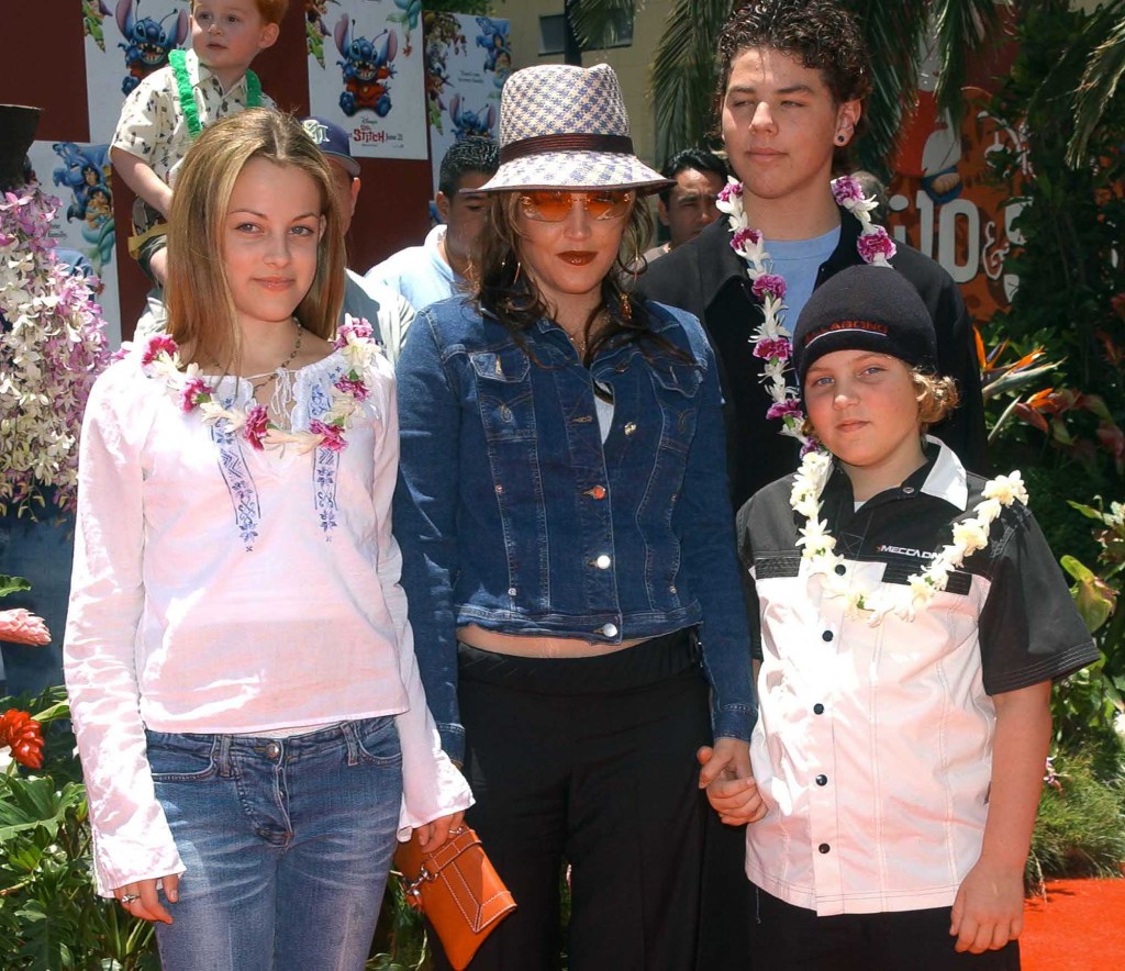 Lisa Marie Presley with her kids Benjamin Keough and Riley Keough and her half-brother  Navarone Garibaldi at the "Lilo and Stitch" premiere in June 2002