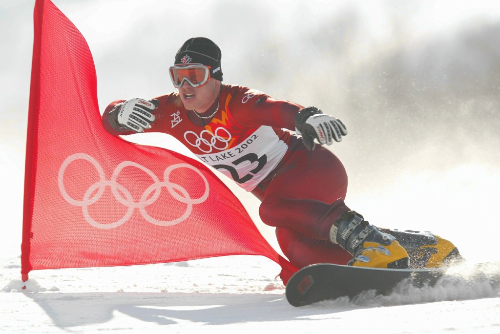 Ryan Wedding of Canada competes in the qualifying round of the men's parallel giant slalom snowboarding event during the Salt Lake City Winter Olympic Games