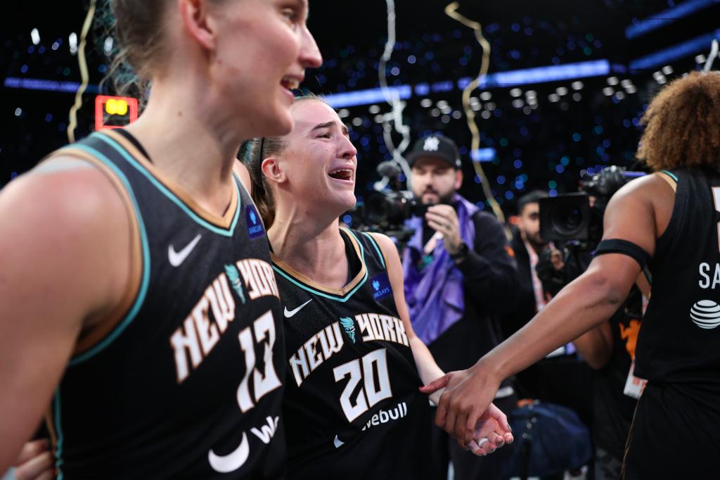 Sabrina Ionescu #20 of the New York Liberty celebrating after winning Game Five of the 2024 WNBA Finals at Barclays Center