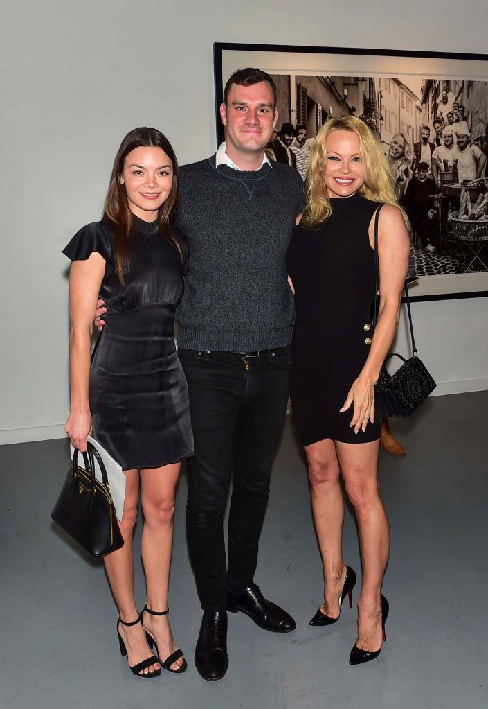 Cooper Hefner is seen above with Scarlett Byrne and Pamela Anderson in 2019.