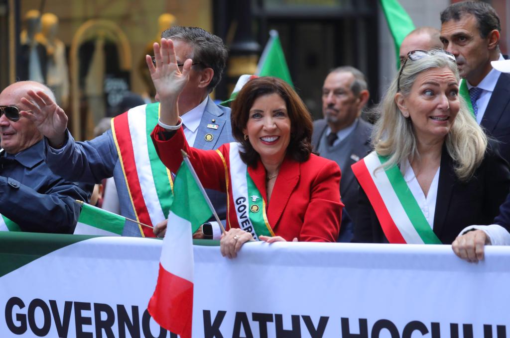 Gov. Kathy Hochul waving to New Yorkers as she marches in the parade.