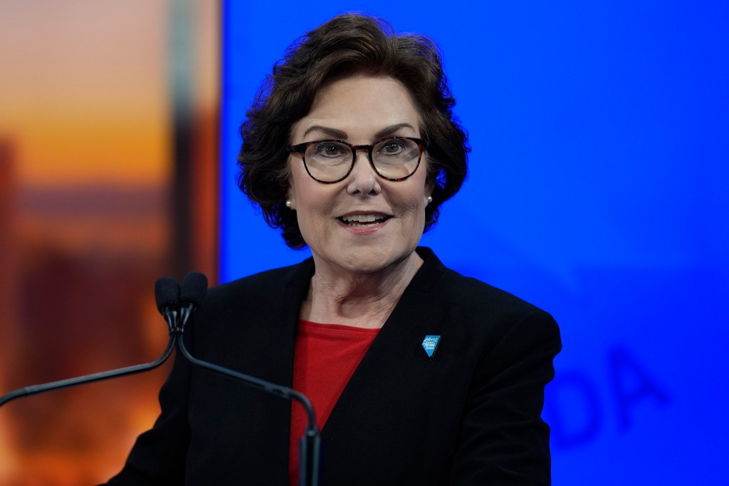 Sen. Jacky Rosen, D-Nev., in a suit and glasses, standing in a TV studio before a debate with Republican senatorial candidate Sam Brown in Las Vegas, 2024.