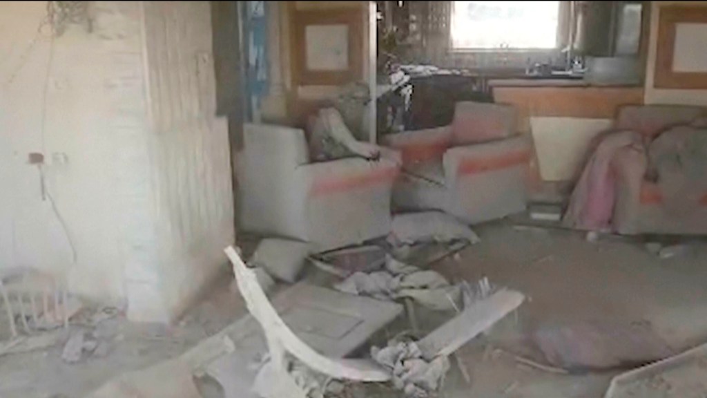 This still image from video provided by the Israel Defense Force (IDF) shows a heavily damaged building with a person the Israeli military identified as Hamas leader Yahya Sinwar seated in a chair in Rafah, Gaza Strip, on Wednesday, Oct. 16, 2024. 