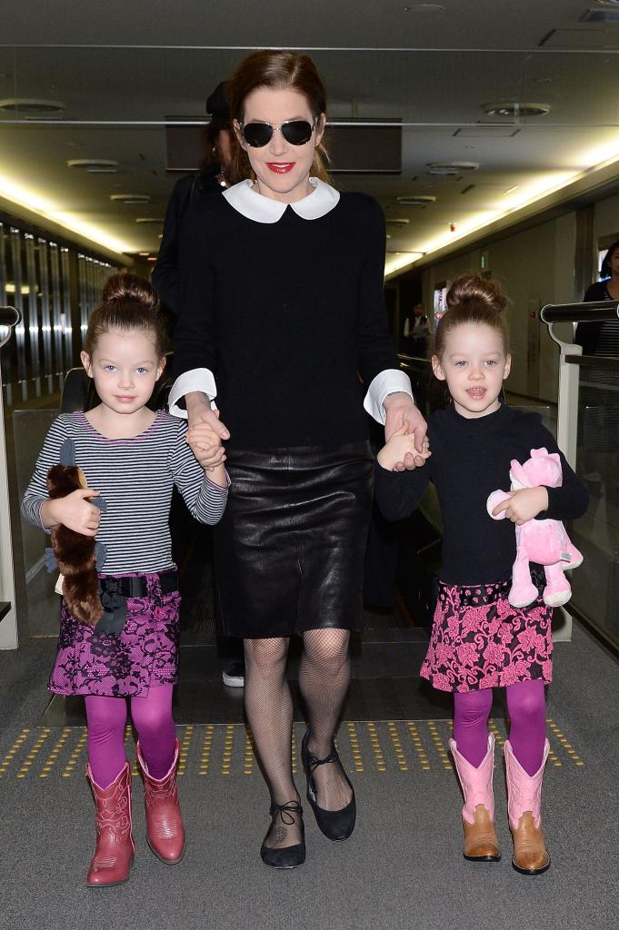 Lisa Marie Presley with her twin daughters in 2014