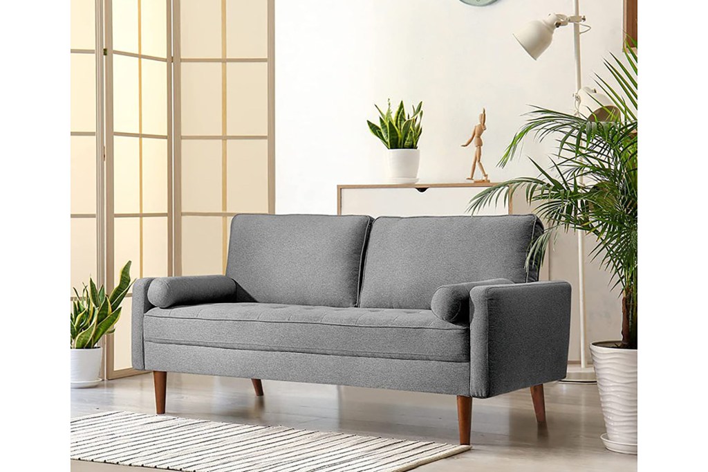 A grey couch in a room