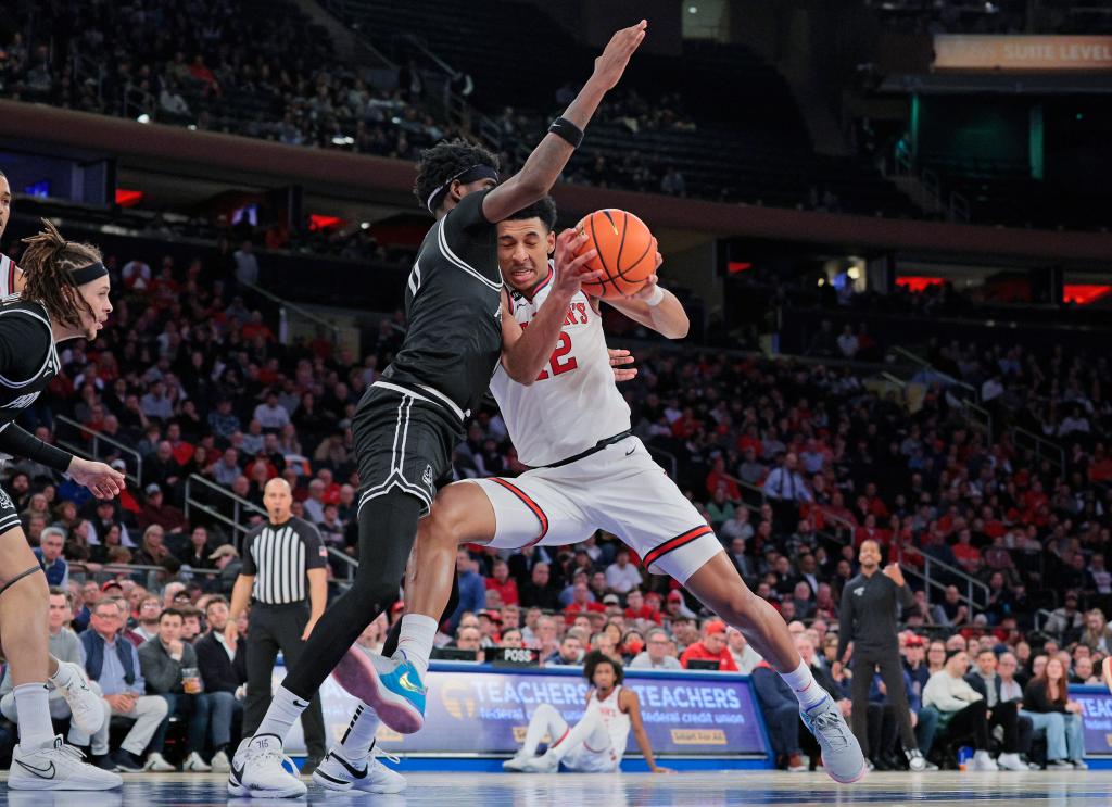 Red Storm guard RJ Luis Jr. #12 drives to the basket as Providence Friars guard Davonte Gaines #0 defends 