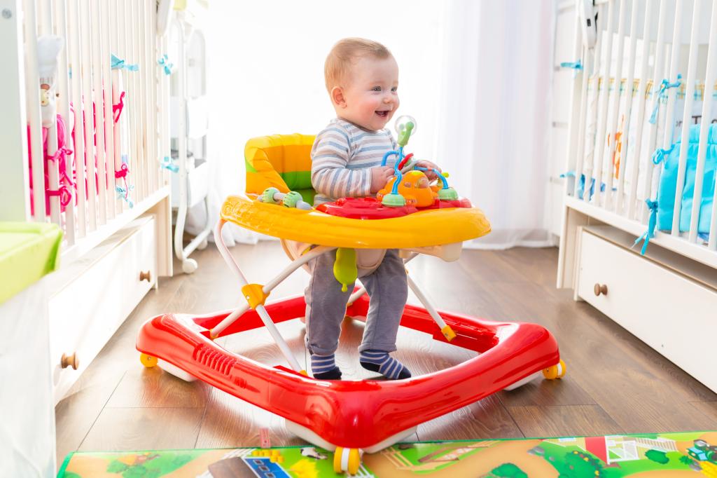 A baby taking his first steps in a baby walker