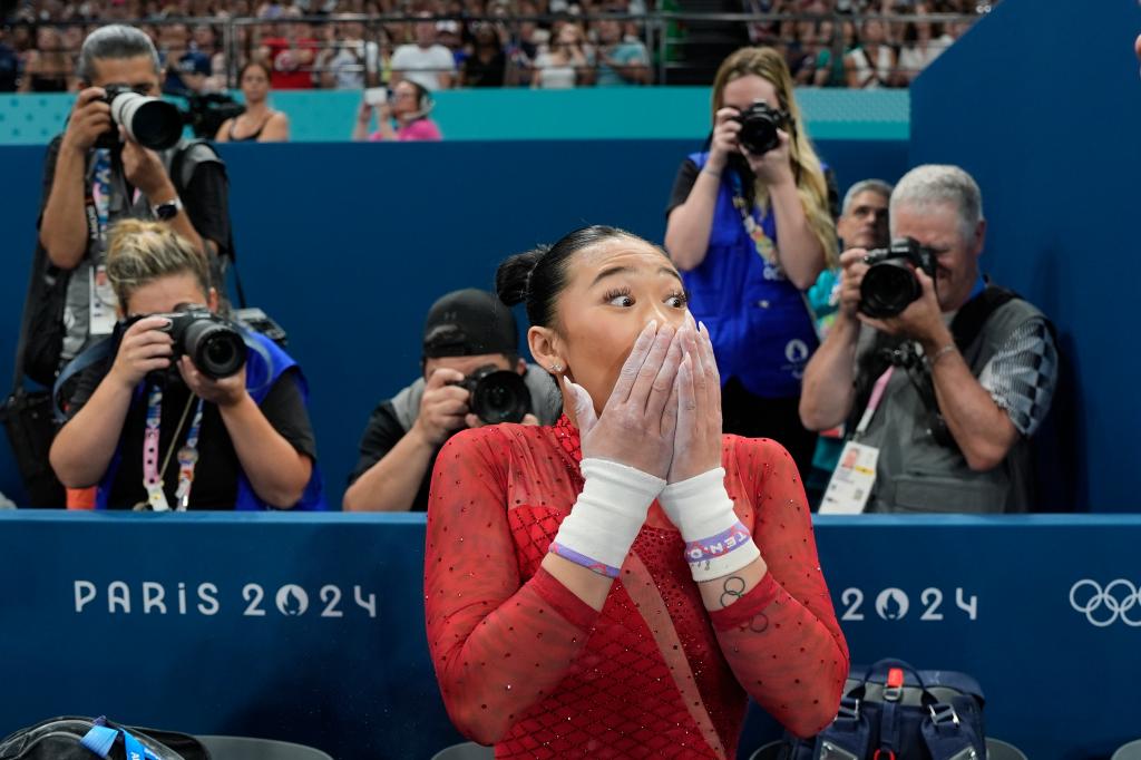 Suni Lee, of the United States, celebrates after winning the bronze medal during the women's artistic gymnastics individual uneven bars finals at Bercy Arena at the 2024 Summer Olympics, Sunday, Aug. 4, 2024, in Paris, France.