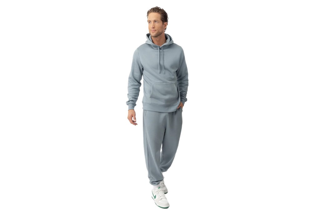 Johnny Strong wearing a grey tracksuit