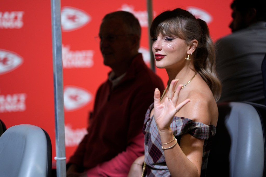 Taylor Swift waves as she arrives for the Chiefs-Saints game on Oct. 7, 2024.