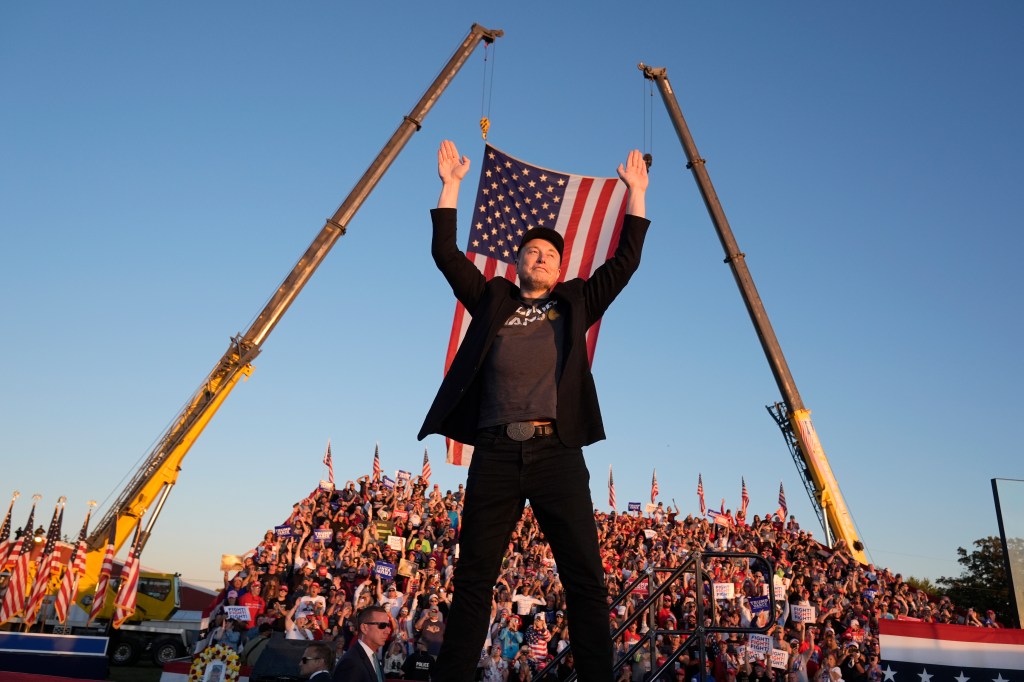 Elon Musk and former President Donald Trump on stage at a campaign rally in Butler, Pa., with Musk advocating for Trump's presidency in 2024 election