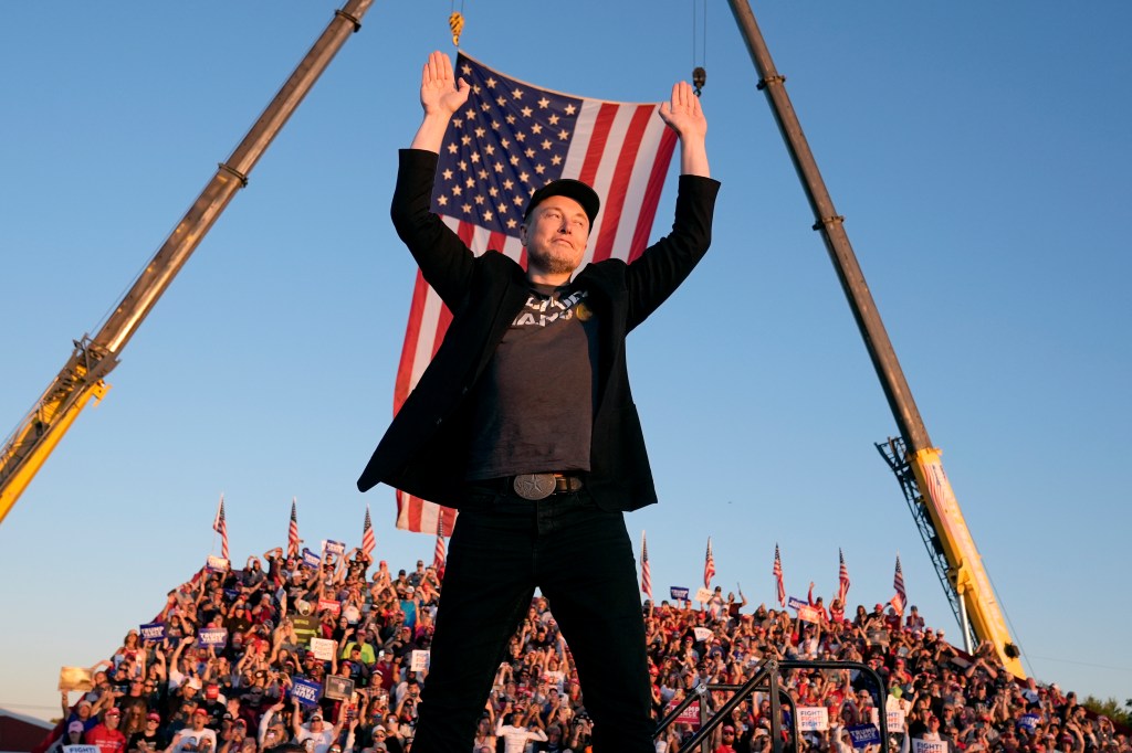 Tesla and SpaceX CEO Elon Musk walks to the stage to speak alongside Republican presidential nominee former President Donald Trump at a campaign event at the Butler Farm Show, Saturday, Oct. 5, 2024, in Butler, Pa.