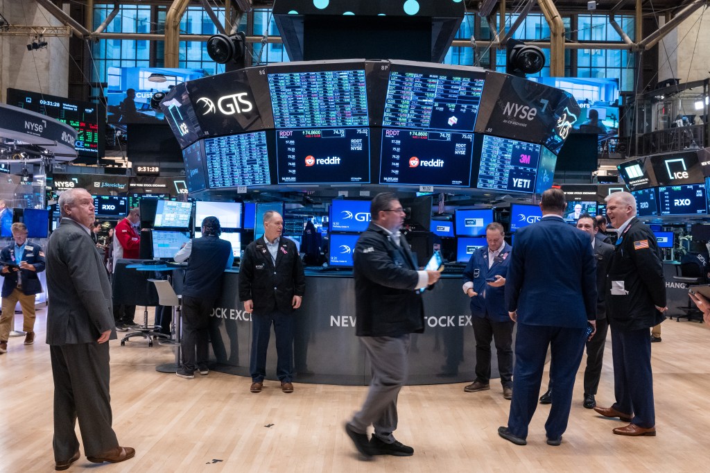 Traders work on floor of New York Stock Exchange on Oct. 16, 2024.