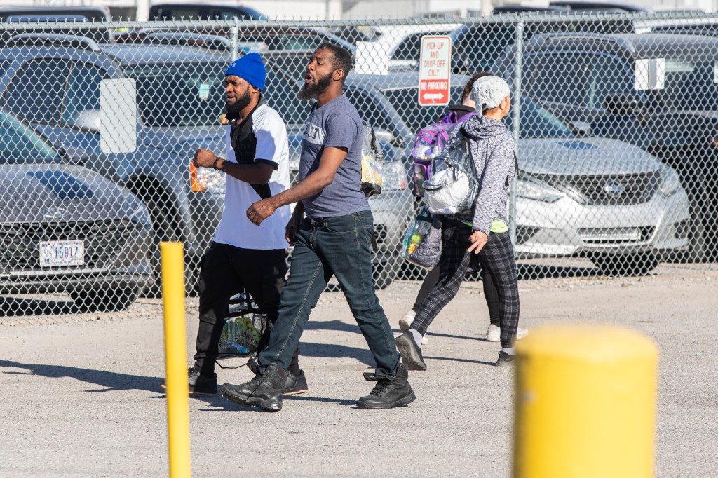 Tyson Foods employees come and go between shifts at the Tyson Food Processing Plant that is located in Indiana. Tyson has been accused of allegedly replacing citizen employees with migrant employees in an effort to decrease pay.