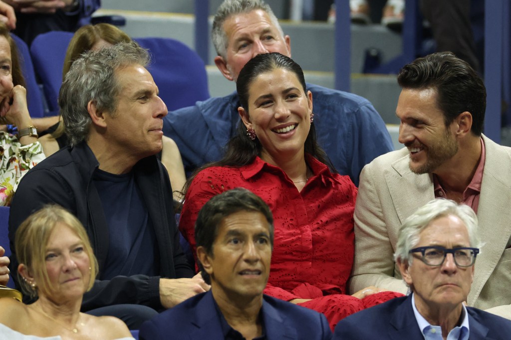 Ben Stiller, Garbine Muguruza and Arthus Borges sit inside Arthur Ashe Stadium during a US Open men's singles first round match on Aug. 27, 2024.