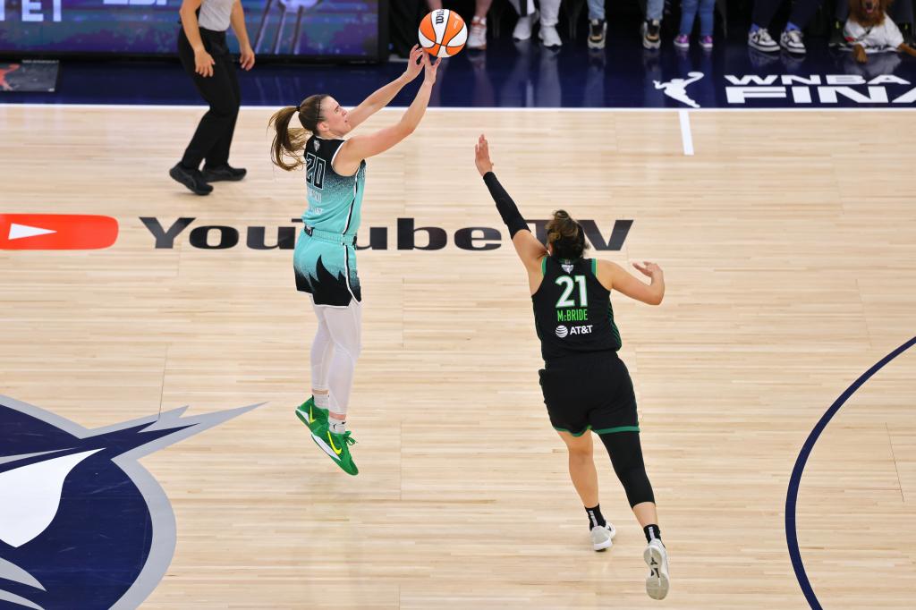 Sabrina Ionescu #20 of the New York Liberty scores the go ahead 3 point basket during the game against the Minnesota Lynx during Game Three of the 2024 WNBA Finals on October 16, 2024 at Target Center in Minneapolis, Minnesota. 