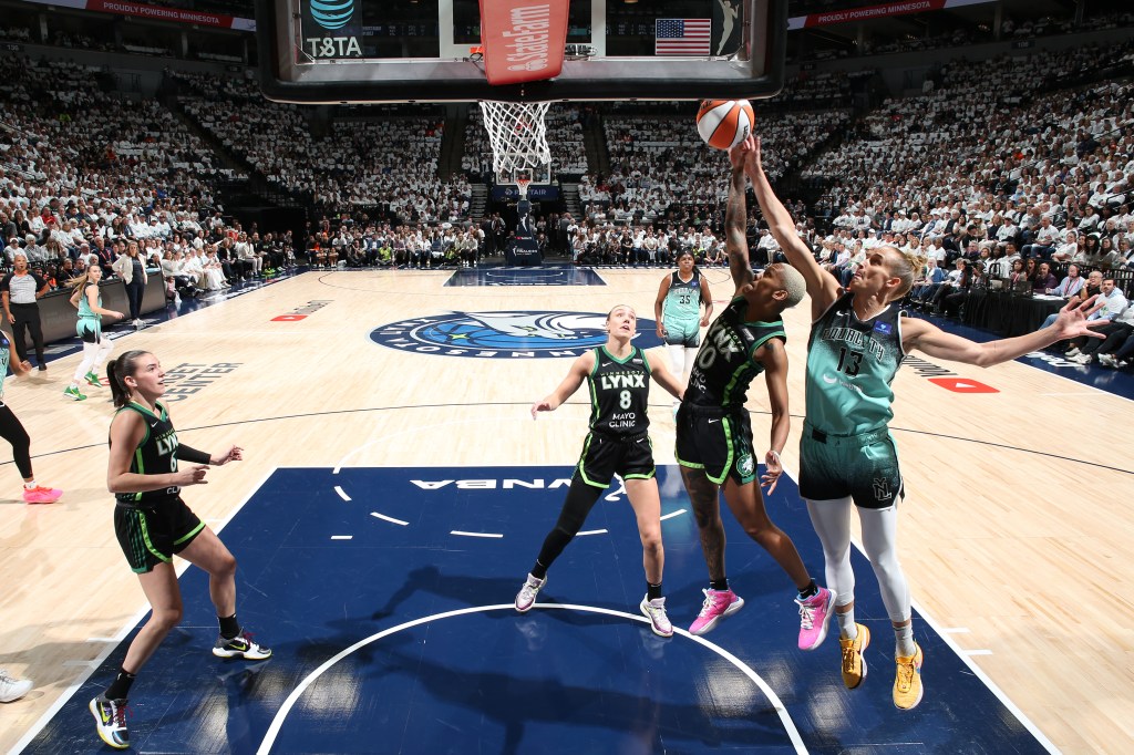 Leonie Fiebich #13 of the New York Liberty attempts to block a shot against Courtney Williams #10 of the Minnesota Lynx during Game Three 