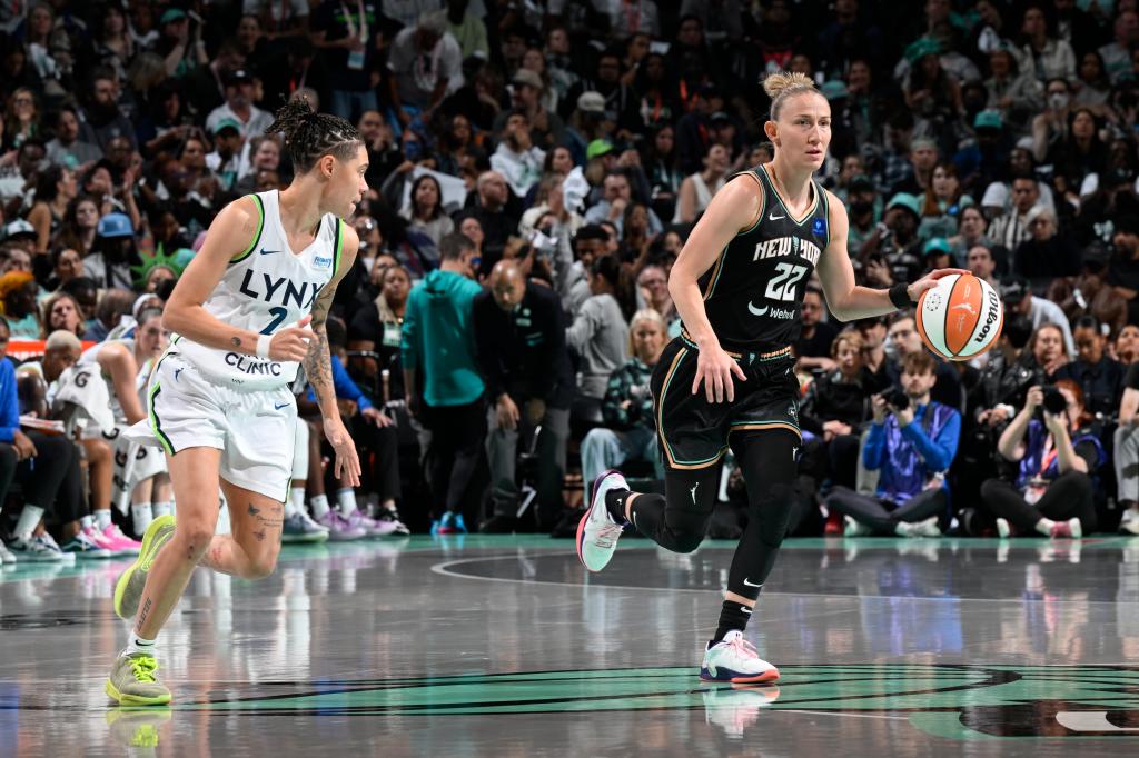 The Liberty's Courtney Vandersloot (22) dribbles against the Lynx in Game 5 of the WNBA Finals on Oct. 20, 2024.