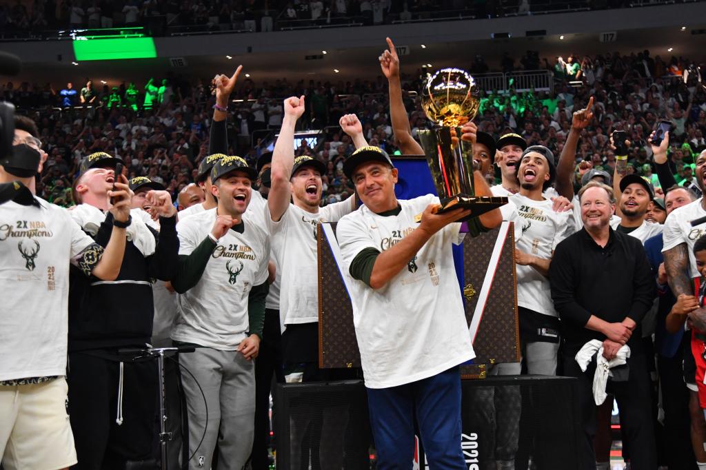 Marc Lasry holding the 2021 NBA Championship Trophy.