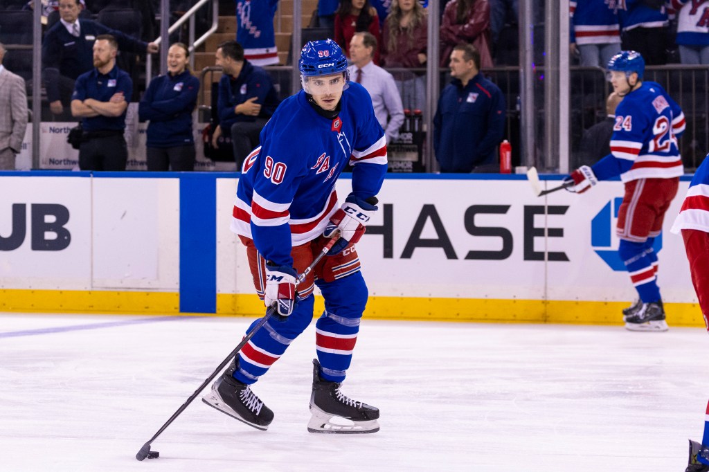 Rangers defenseman Victor Mancini (90) warms up before a game.