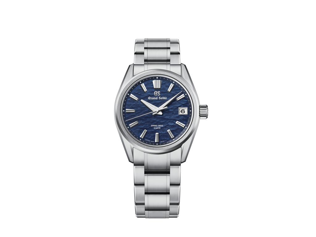 Silver Grand Seiko watch from the Evolution 9 Collection with a blue face and detailed markings