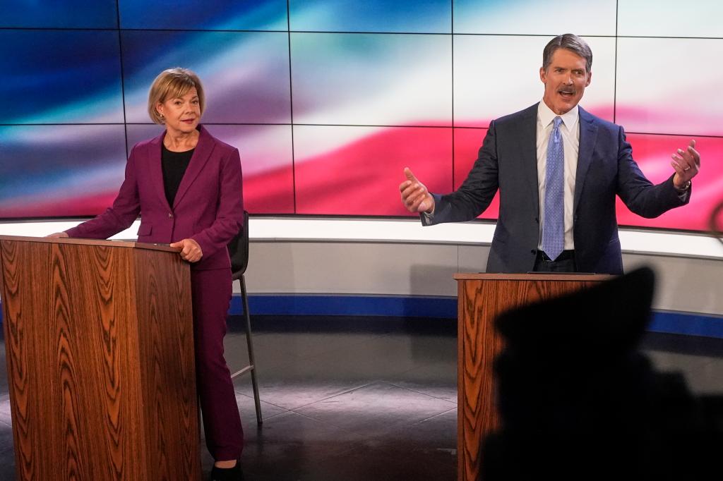 Wisconsin Senate candidates, Republican Eric Hovde and Democratic U.S. Sen. Tammy Baldwin, standing at podiums before a televised debate in Madison, Wis., 2024.