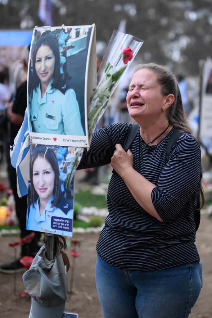 A grieving woman crying at the memorial for Yulia Waxer Daunov during the commemoration of the Hamas October 7 attacks anniversary in Israel