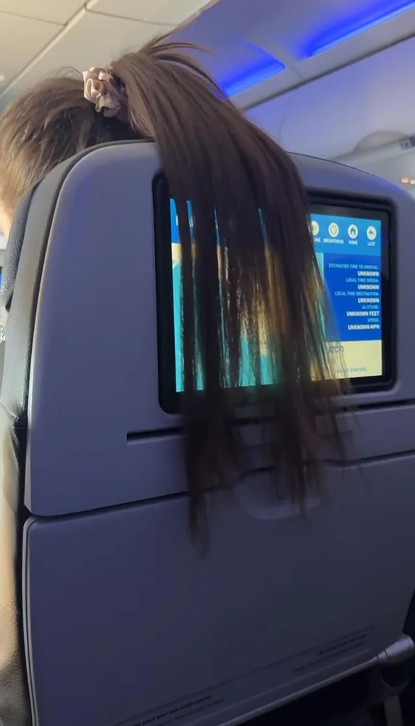 The hair draped over the man's screen.