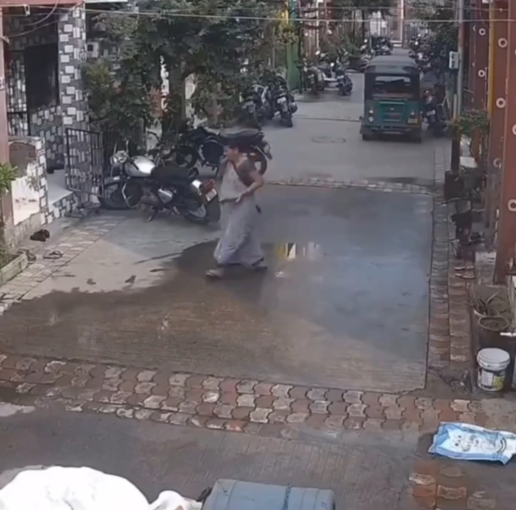 Woman in India is unharmed after a water tank falls on her.