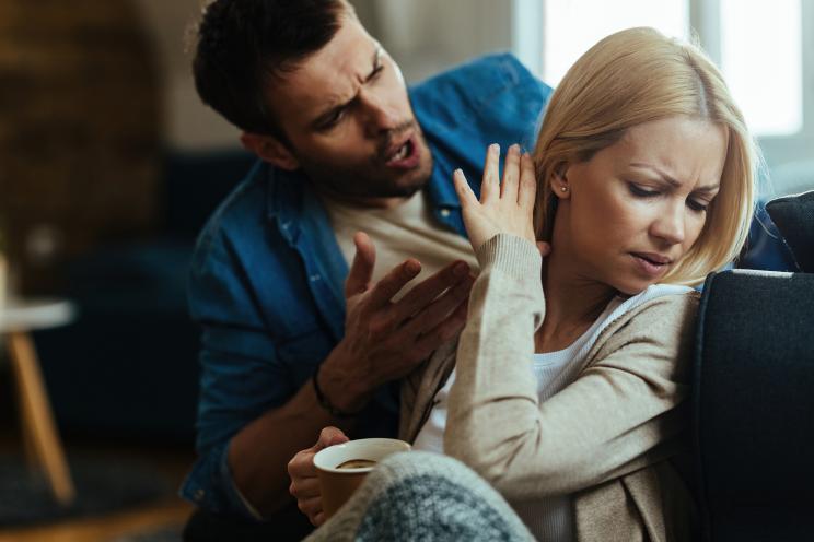 Young couple, resembling Antonis Fotsis, experiencing relationship difficulties and arguing at home.