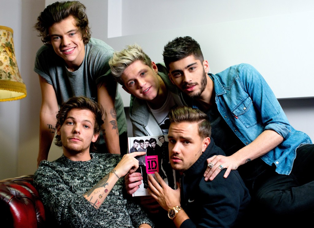 Zayn Malik, Liam Payne, Louis Tomlinson, Niall Horan and Harry Styles from One Direction pose as they attend the book signing of One Direction's new book "Where We Are."