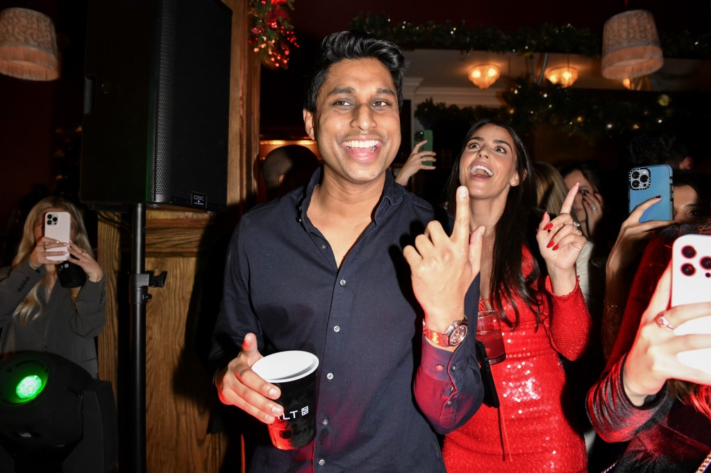 Ankur Jain and Erika Hammond attending Bilt Rewards' 2023 Winter Holiday House Party at Maxwell Social in New York City