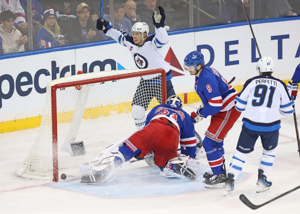 Vladislav Namestnikov of the Winnipeg Jets reacts after he scores a goal around the side of Igor Shesterkin #31 of the New York Rangers during the third period. 