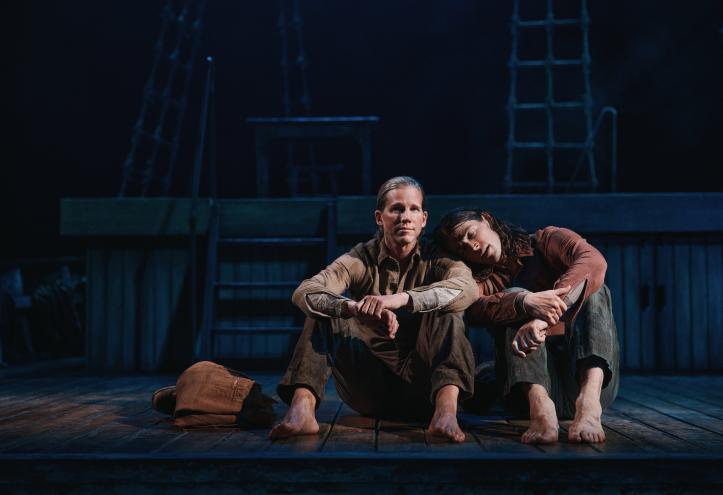 Stark Sands and Adrian Blake Enscoe  sitting on a boat