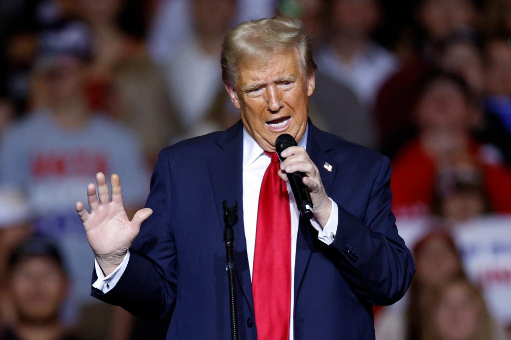 Former US President and Republican presidential candidate Donald Trump gestures as he speaks at a campaign rally at the Fiserv Forum in Milwaukee, Wisconsin, November 1, 2024.