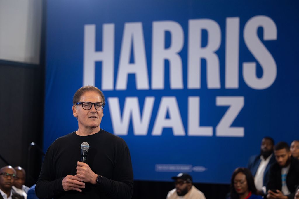 Mark Cuban at mic with Harris sign