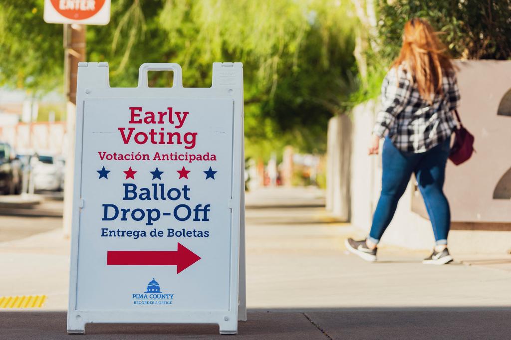 People exiting a polling station in Tucson for early voting on Oct. 16, 2024.