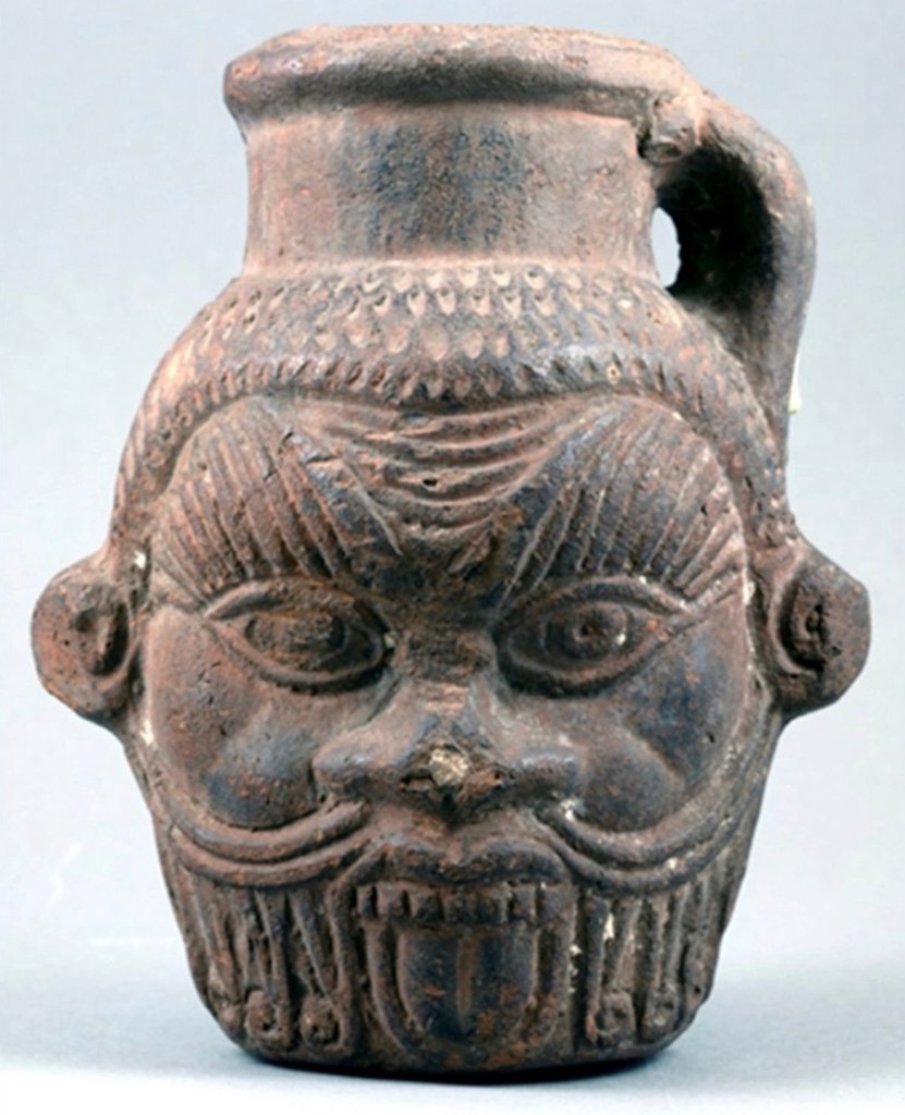 Ancient Egyptian Bes mug displayed at Tampa Museum of Art, Florida